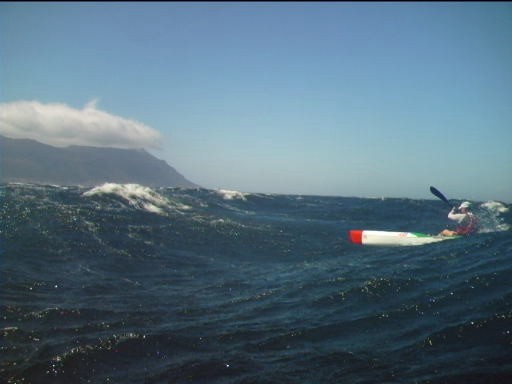 Jean Austin taking off down a wave